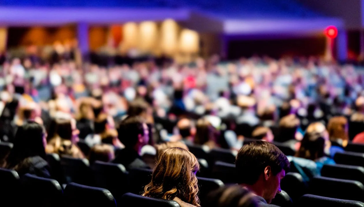 Group of people attending an event in a lecture hall